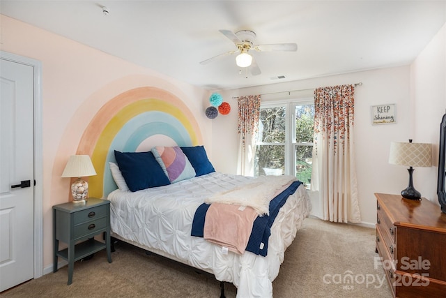 bedroom featuring baseboards, carpet flooring, visible vents, and a ceiling fan