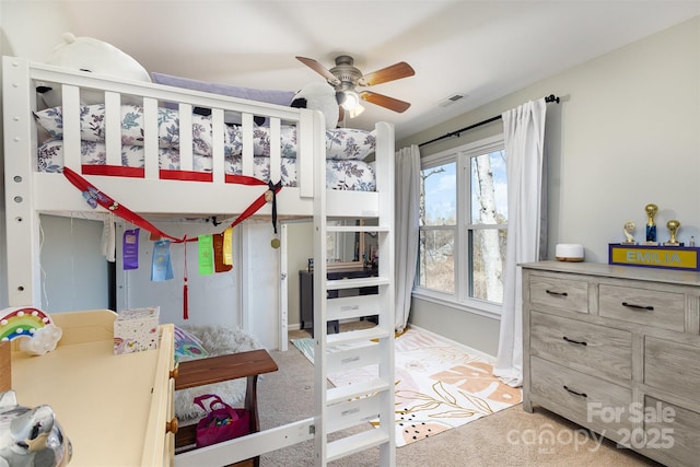 bedroom with baseboards, visible vents, and carpet flooring