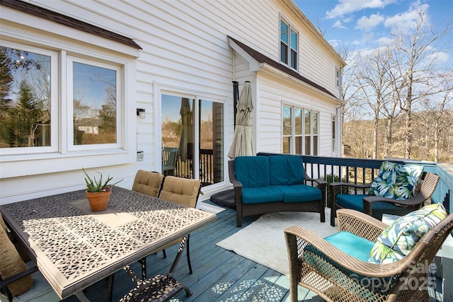 wooden terrace with outdoor lounge area