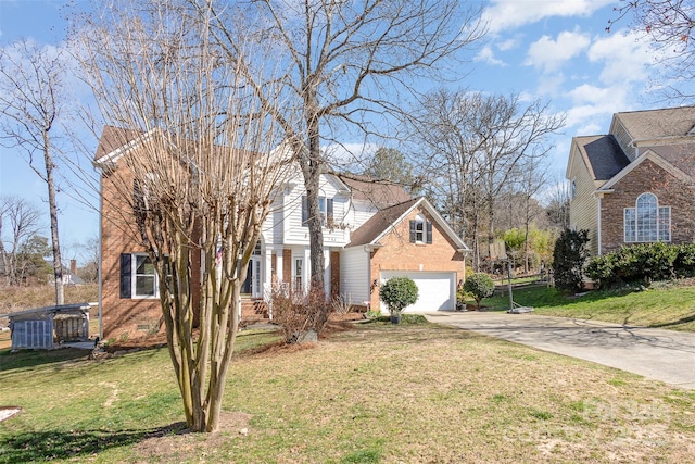 traditional-style home featuring brick siding, an attached garage, a front yard, crawl space, and driveway