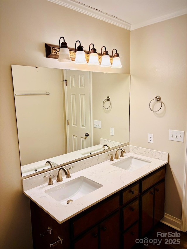 bathroom with double vanity, ornamental molding, and a sink