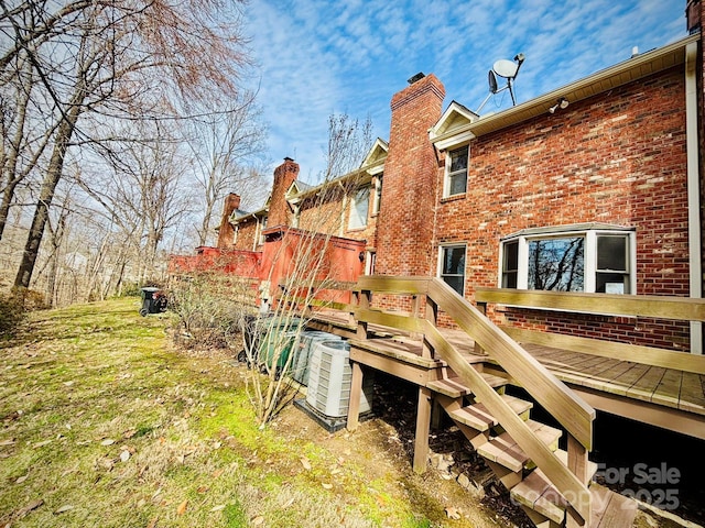 exterior space with a deck and central AC