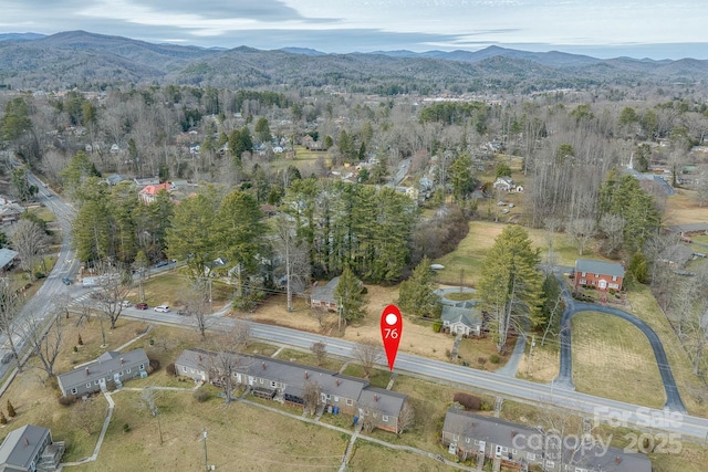 birds eye view of property with a mountain view