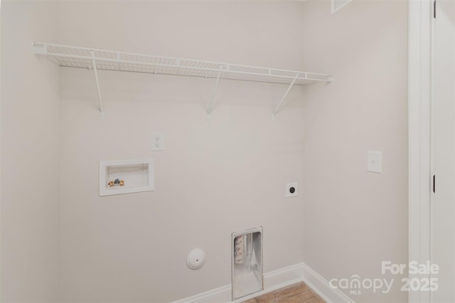 washroom with hookup for a washing machine, hookup for an electric dryer, gas dryer hookup, laundry area, and baseboards