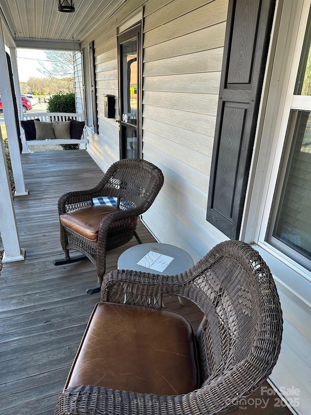 wooden deck featuring a porch