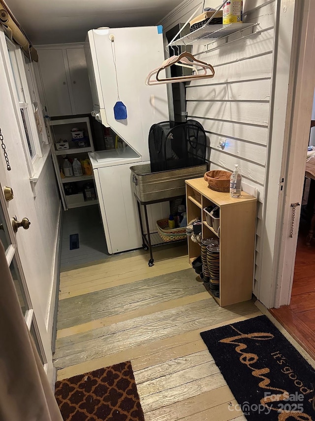 kitchen with light wood-type flooring and washer / dryer