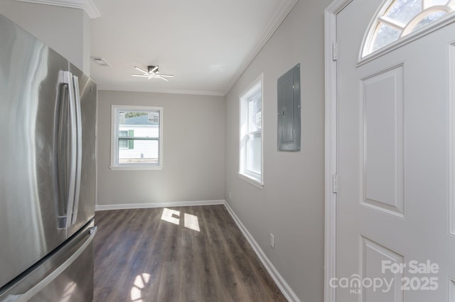 interior space featuring dark wood-style floors, crown molding, visible vents, electric panel, and baseboards