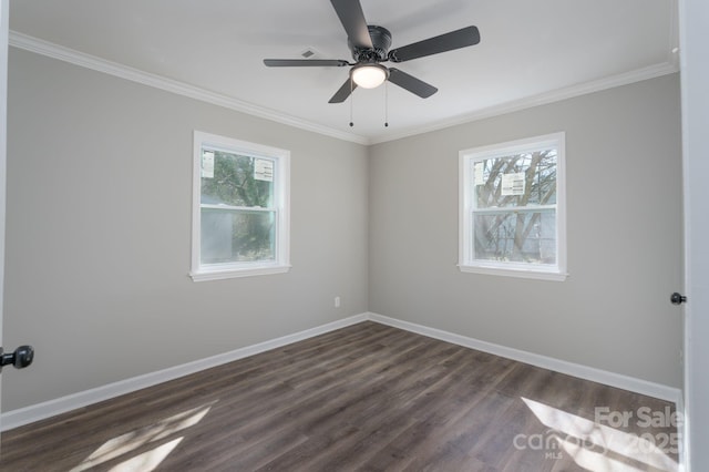 unfurnished room with ornamental molding, dark wood-type flooring, a ceiling fan, and baseboards