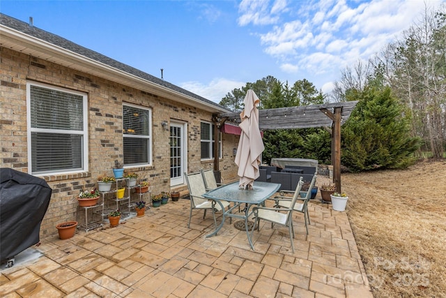 view of patio with outdoor dining space, a grill, and a pergola