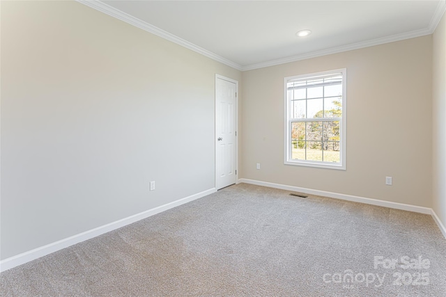 empty room featuring visible vents, baseboards, crown molding, carpet floors, and recessed lighting