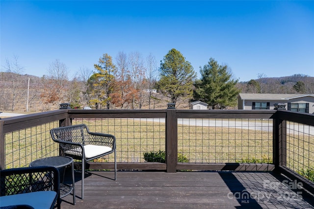 deck featuring a lawn