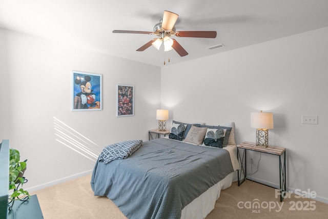 carpeted bedroom with visible vents, ceiling fan, and baseboards