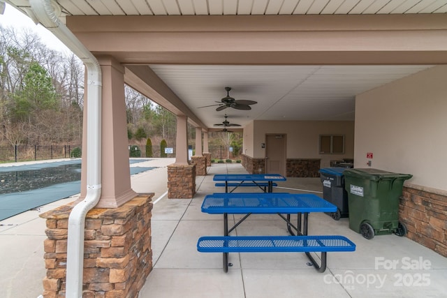 view of patio / terrace featuring a ceiling fan, a fenced in pool, and fence