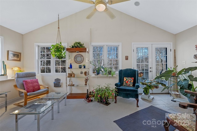 interior space with ceiling fan, high vaulted ceiling, and french doors