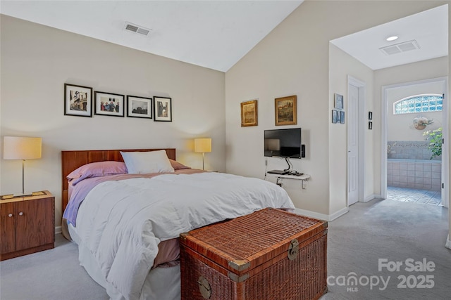 carpeted bedroom featuring baseboards, visible vents, and vaulted ceiling