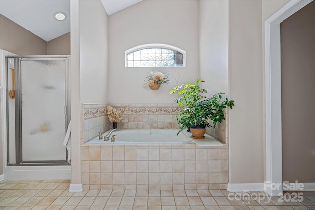 full bath with a stall shower, tile patterned floors, lofted ceiling, and a bath