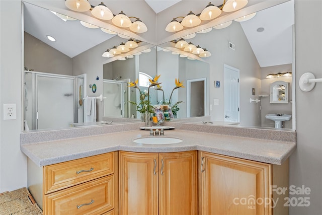 full bathroom with visible vents, vaulted ceiling, a shower stall, and vanity