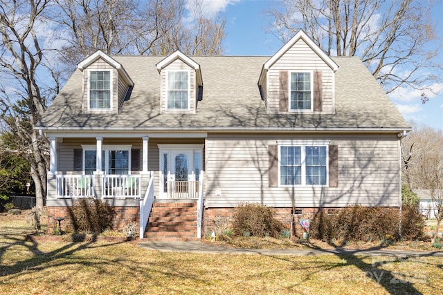 cape cod home featuring crawl space, a shingled roof, a front lawn, and a porch