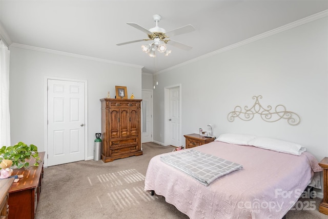 bedroom featuring light carpet, ceiling fan, baseboards, and crown molding