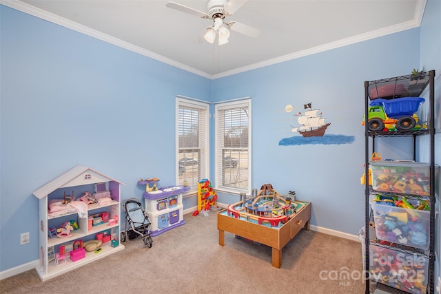 rec room featuring carpet floors, ornamental molding, and baseboards