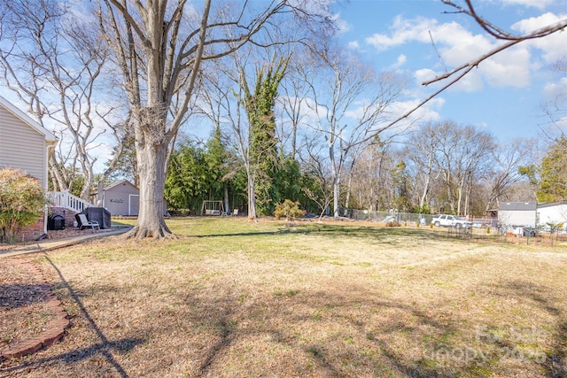 view of yard featuring fence