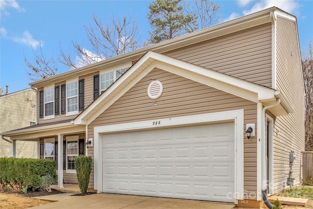 view of front of home with a garage and concrete driveway