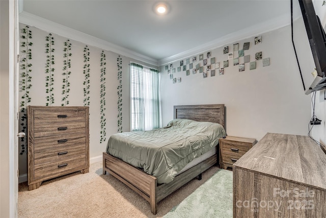 bedroom with ornamental molding and carpet floors