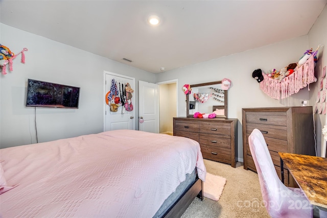 bedroom with light carpet and visible vents