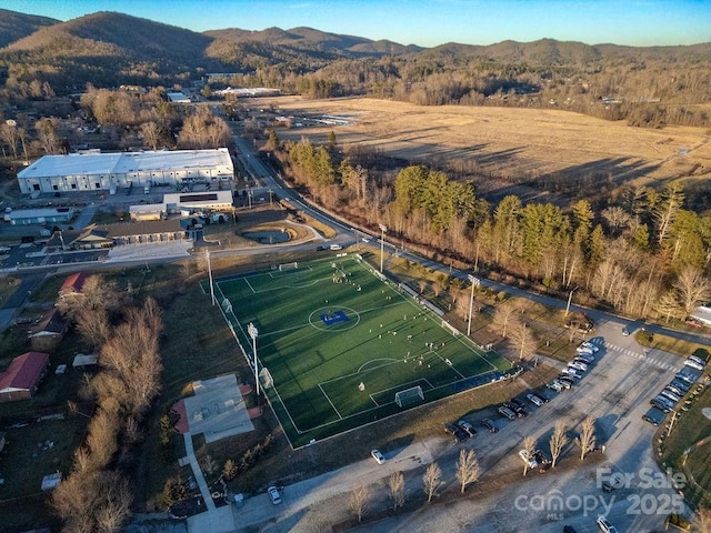 birds eye view of property featuring a mountain view