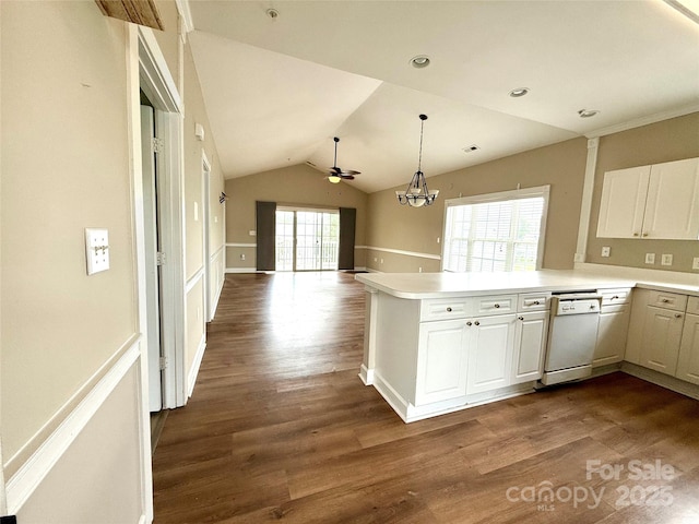 kitchen featuring dishwasher, a peninsula, lofted ceiling, and dark wood-style flooring