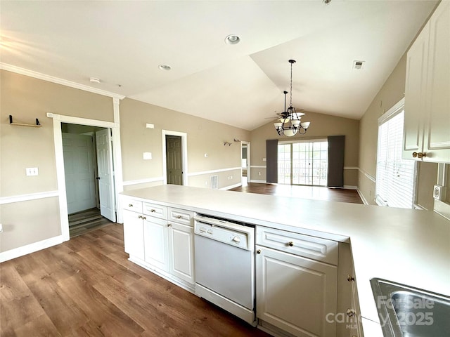 kitchen with white dishwasher, dark wood-type flooring, white cabinetry, and a peninsula