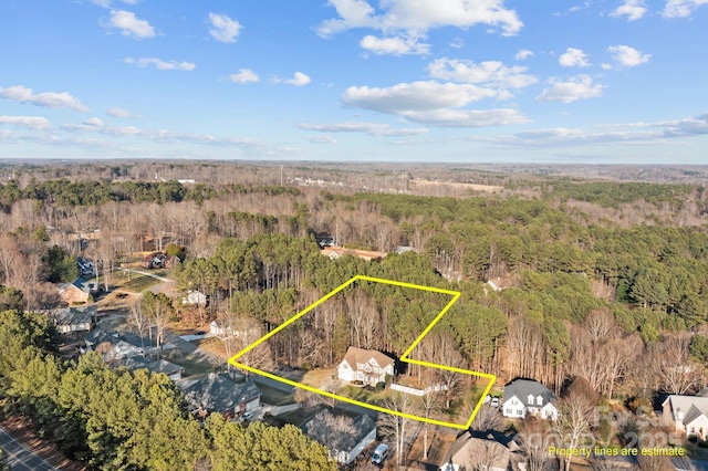 bird's eye view featuring a forest view