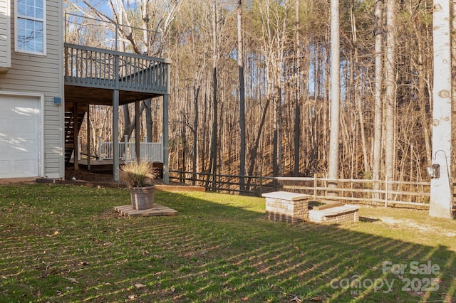 view of yard featuring a wooden deck and fence