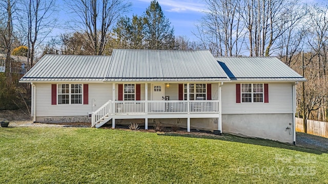 single story home featuring metal roof and a front lawn