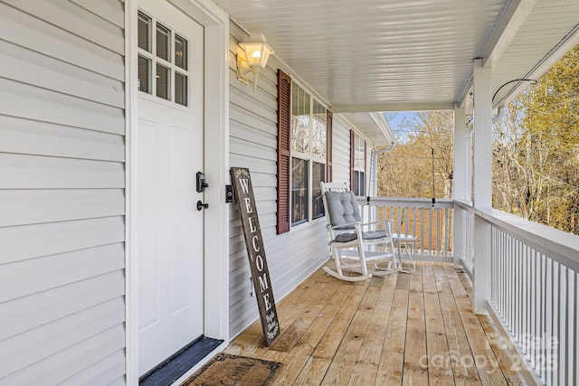 wooden terrace featuring a porch