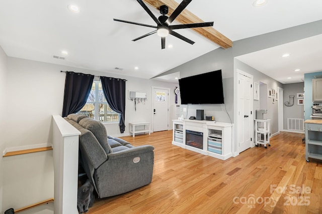 living room with vaulted ceiling with beams, ceiling fan, recessed lighting, visible vents, and light wood-style floors