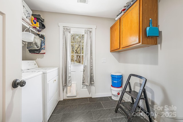 laundry room with washer and dryer, cabinet space, visible vents, and baseboards