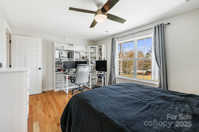 bedroom featuring light wood-style floors and ceiling fan