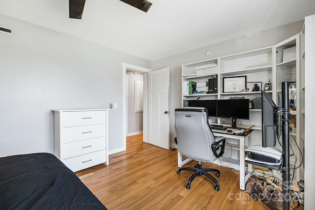 office featuring baseboards and light wood-style floors