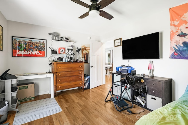 bedroom with a ceiling fan and wood finished floors