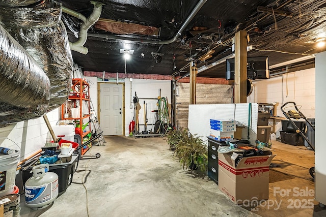 garage with concrete block wall