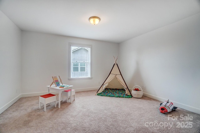 game room with carpet and baseboards