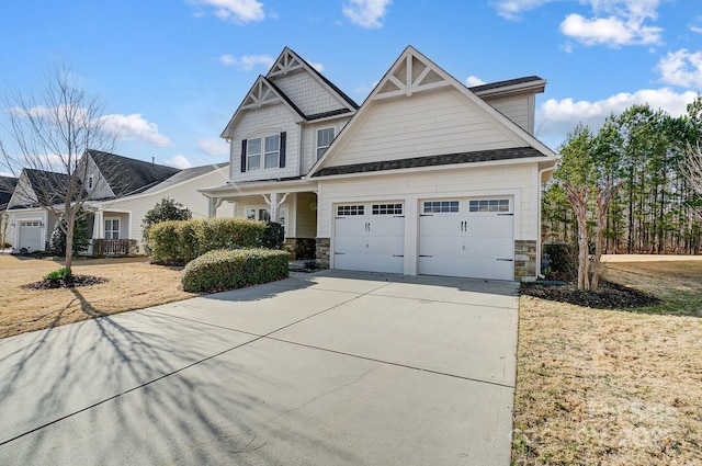 5006 Sand Trap Ct Unit 142, Monroe, NC 28112 - craftsman-style house with stone siding, an attached garage, and driveway
