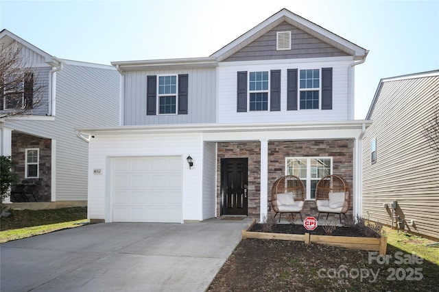 traditional home featuring an attached garage, stone siding, a porch, and concrete driveway