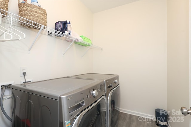 laundry room featuring laundry area, baseboards, dark wood finished floors, and independent washer and dryer