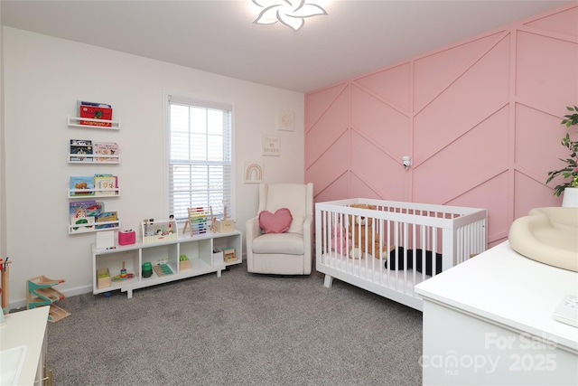 bedroom with carpet floors and a crib