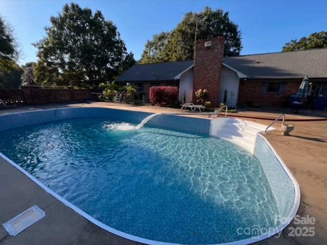 view of pool with a fenced in pool and a patio