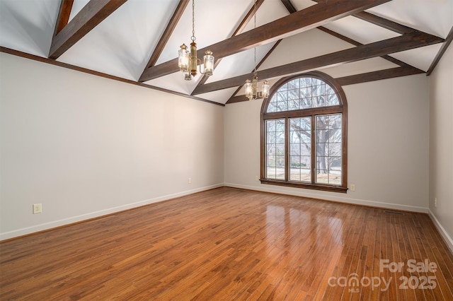 spare room featuring a chandelier, high vaulted ceiling, wood finished floors, baseboards, and beamed ceiling