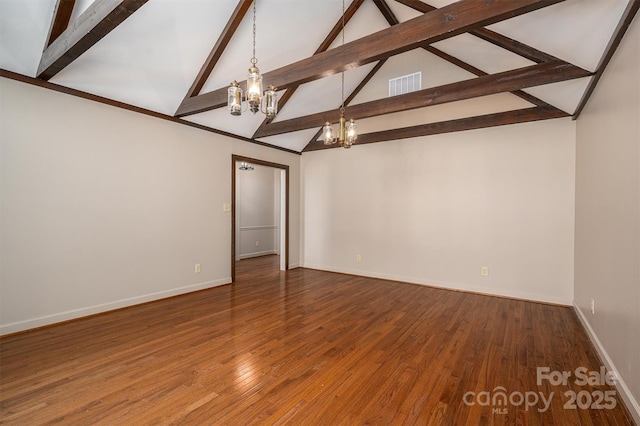 unfurnished room with a chandelier, wood finished floors, visible vents, baseboards, and beamed ceiling