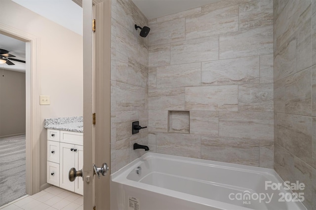 full bath featuring ceiling fan, tile patterned flooring, shower / tub combination, and vanity